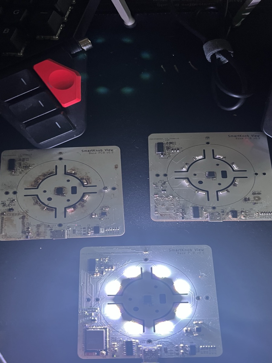 Three SmartKnob View Base PCB v0.5 boards — one illuminated with full LED ring